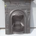 Black cast iron, arched combination fireplace
