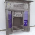 Black cast iron combination fire place, with blue tile insirts