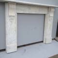 Whit Carrara marble blue grey vain, with fluted shell corble, some staining