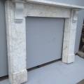 White marble surround with blue grey vain, some staining